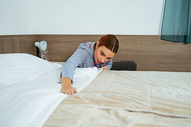 Hotel housekeeping staff preparing luxury rooms